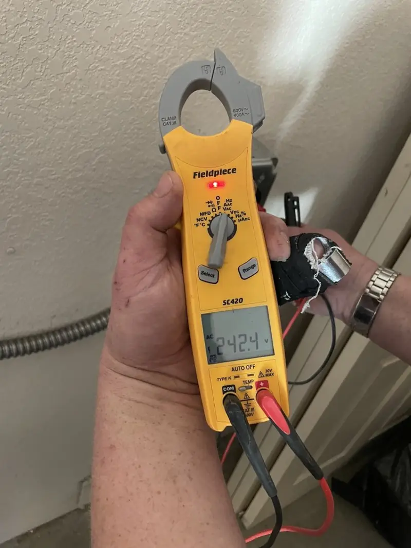 Voltage testing with clamp meter during Outlet Installation in Eagle Mountain